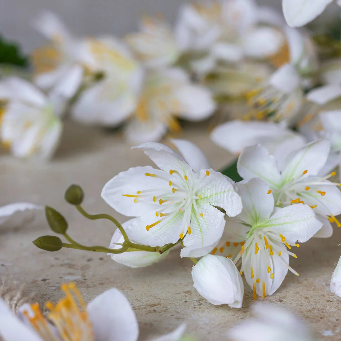 Abigail Ahern Artificial Cream Campanula, close-up of the white bell-shaped blossoms with yellow centers