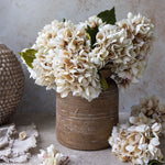Abigail Ahern Artificial Hydrangea in Morning Mist, cream faux hydrangea heads in a rustic brown vase