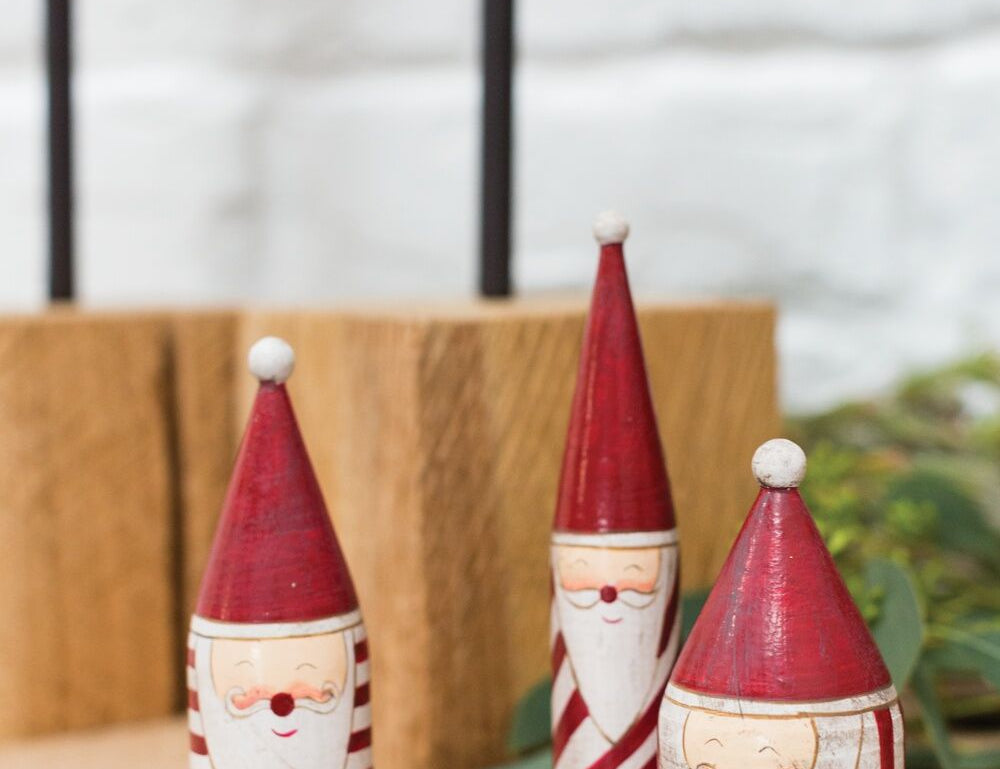 Candystripe Santa Collection, second view of the wooden Santas in red and white hats