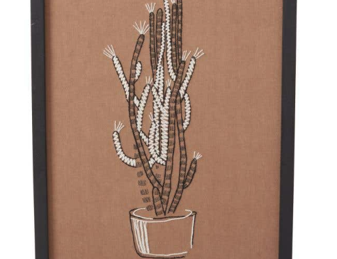 Tolima Euphorbia Wall Art, the embroidered euphorbia cactus in black and white on sandy brown textile.