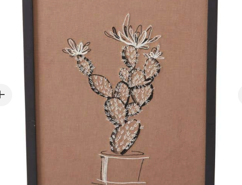 Tolima Prickly Pear Wall Art, the embroidered prickly pear cactus in black and white on sandy brown textile.