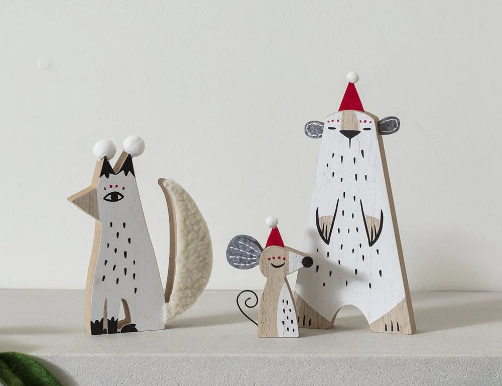 Winter Party Pip Figurine, second view of the wooden figure in a red Santa hat with a silver disco ball