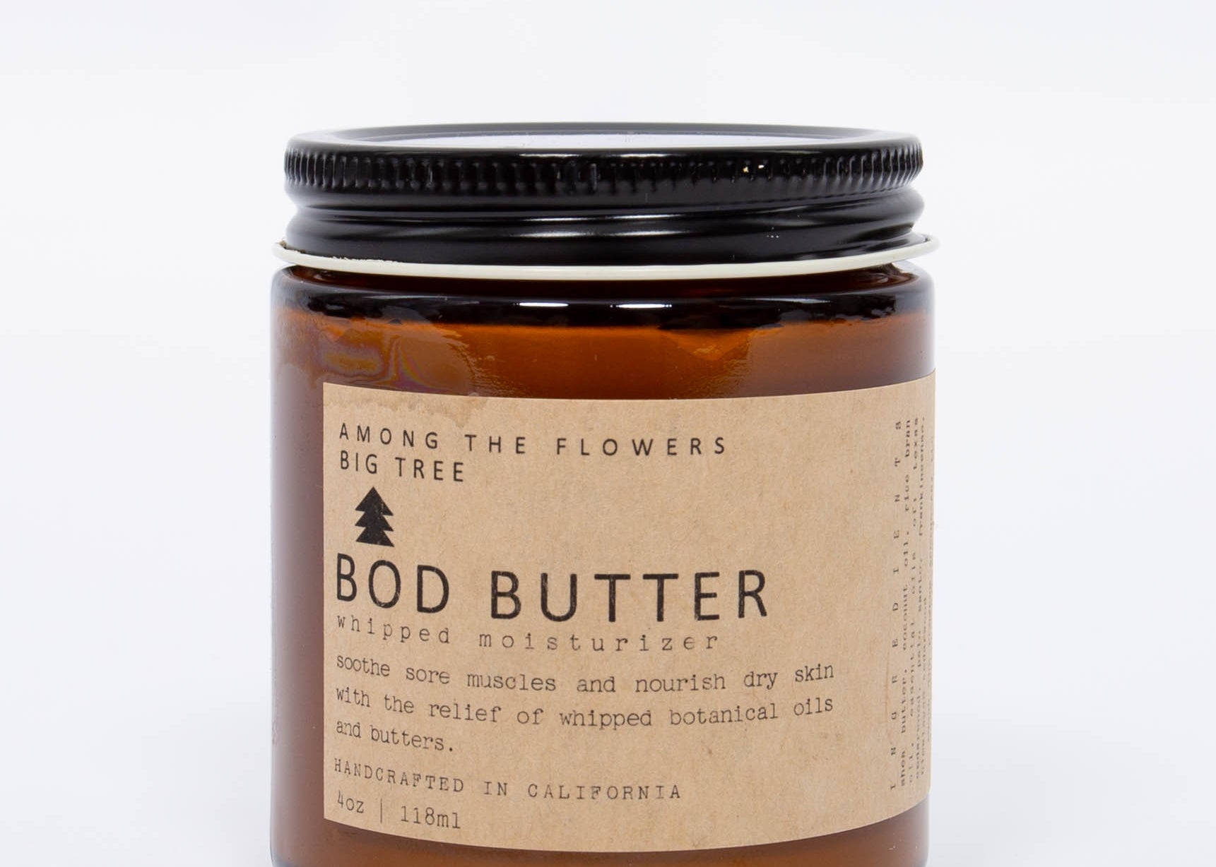 Among the Flowers Big Tree Bod Butter amber glass jar with a black lid and kraft label, front view