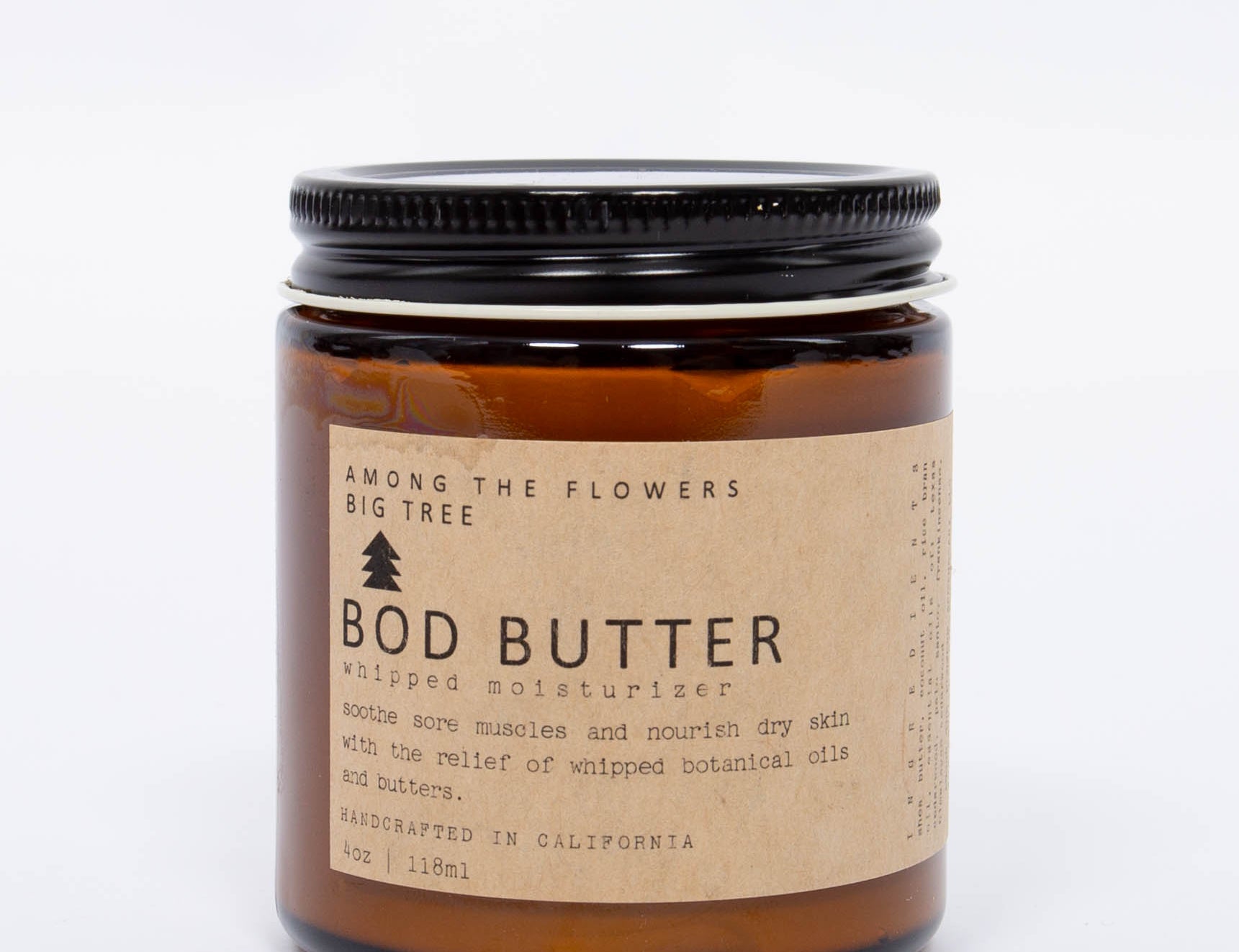 Among the Flowers Big Tree Bod Butter amber glass jar with a black lid and kraft label, front view