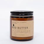 Among the Flowers Big Tree Bod Butter amber glass jar with a black lid and kraft label, front view