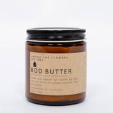 Among the Flowers Big Tree Bod Butter amber glass jar with a black lid and kraft label, front view