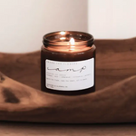 Among the Flowers Camp Candle lit inside a carved wooden bowl