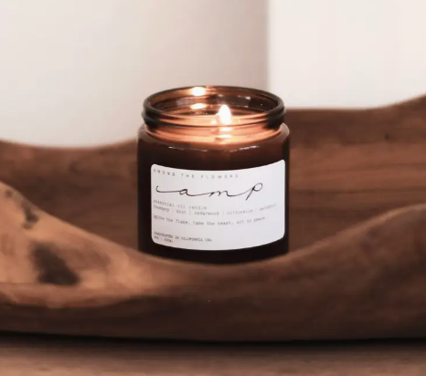 Among the Flowers Camp Candle lit inside a carved wooden bowl