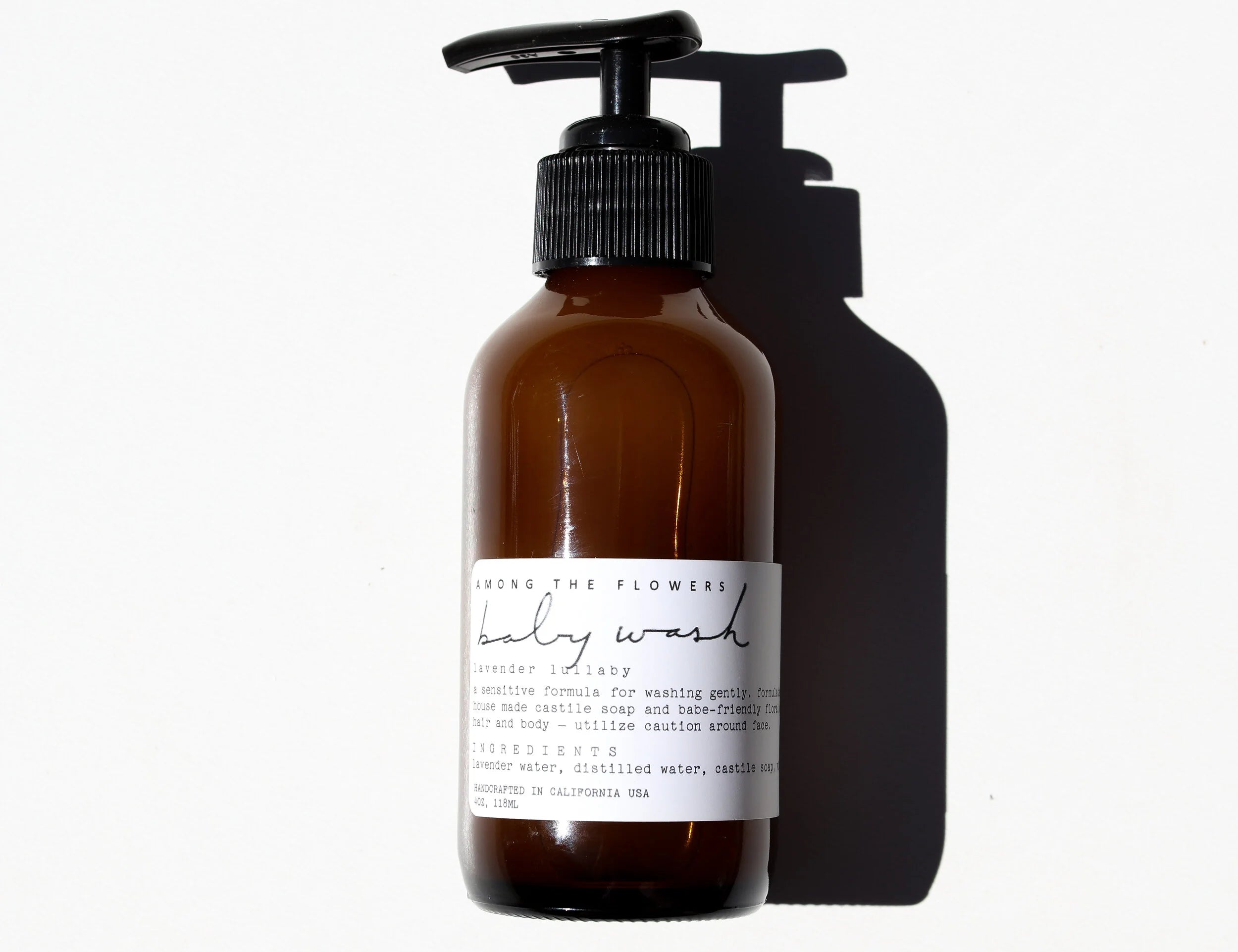 Among the Flowers Lavender Lullaby Baby Wash in an amber pump bottle