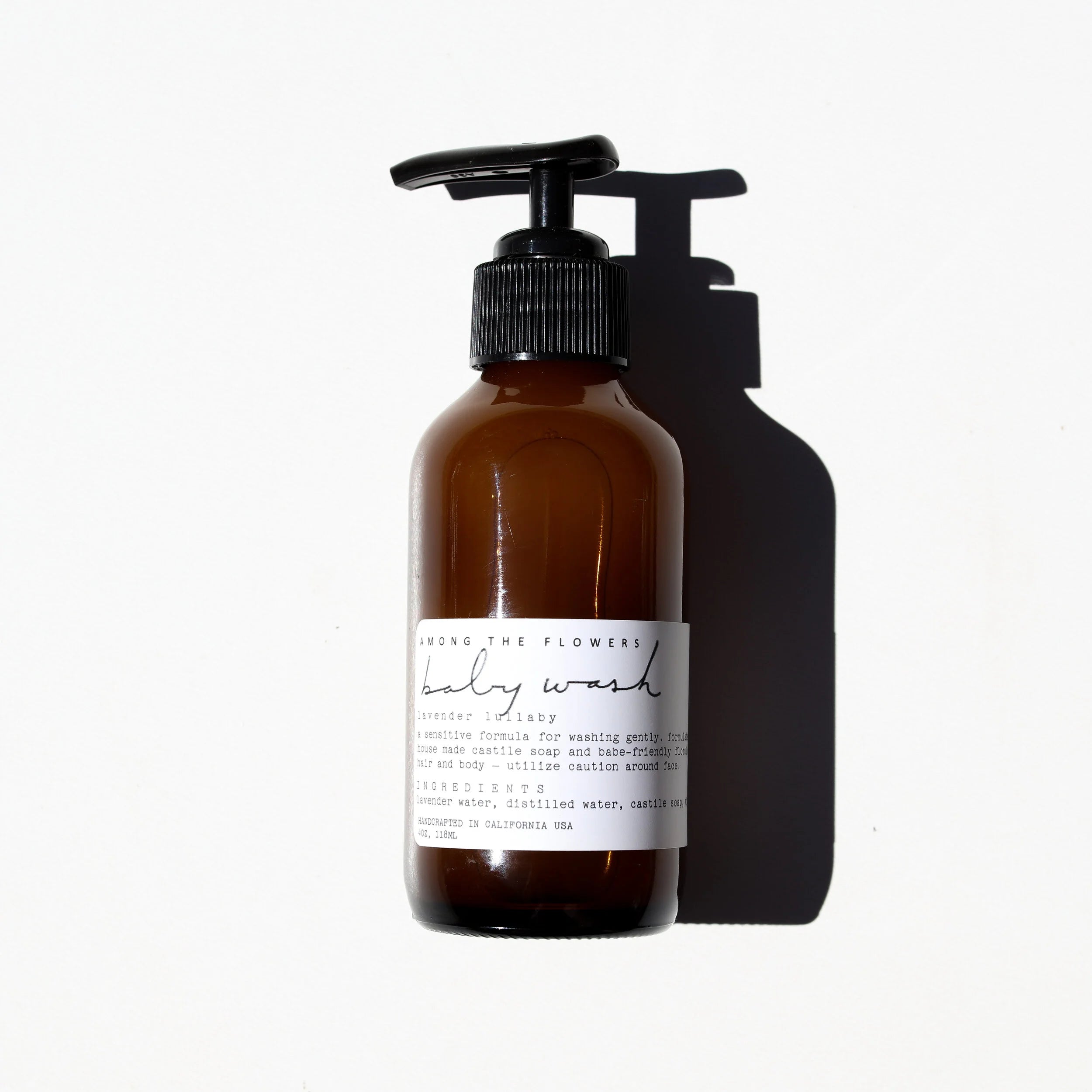 Among the Flowers Lavender Lullaby Baby Wash in an amber pump bottle