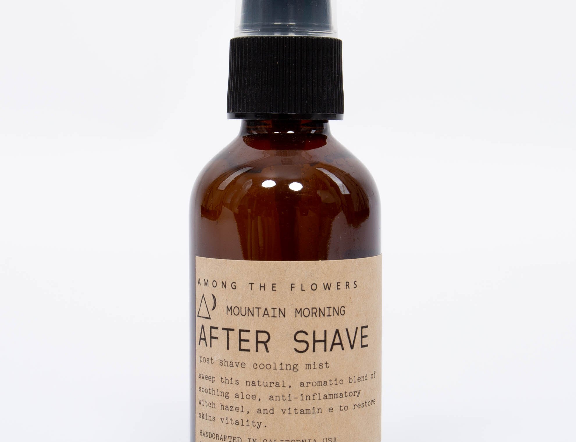 Among the Flowers Mountain Morning After Shave in an amber glass spray bottle