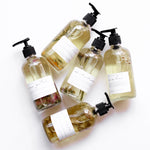Several Among the Flowers botanical oil pump bottles laid out together from above