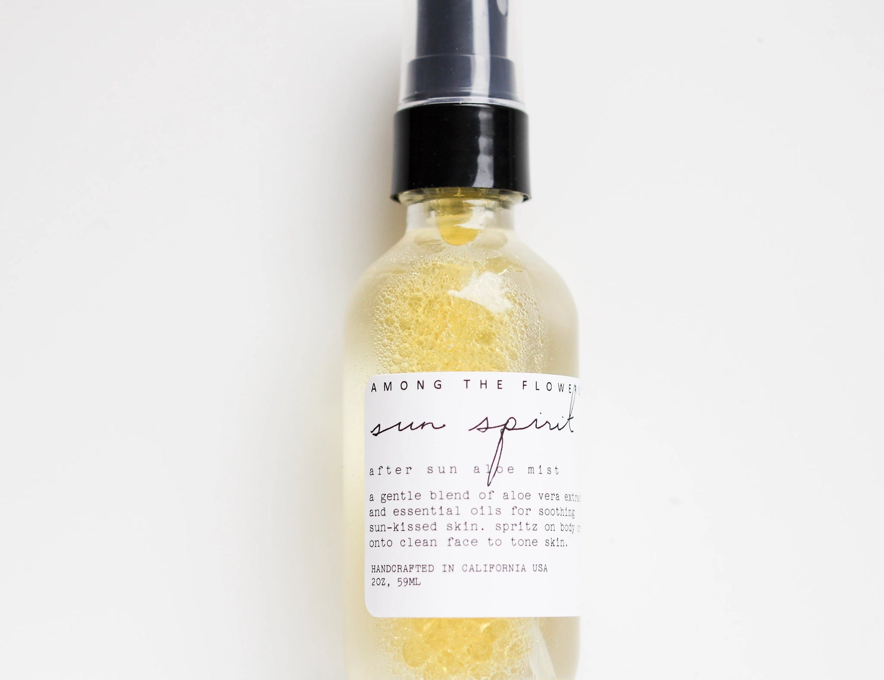 Among the Flowers Sun Spirit Cooling Aloe Mist in a clear spray bottle with a white label