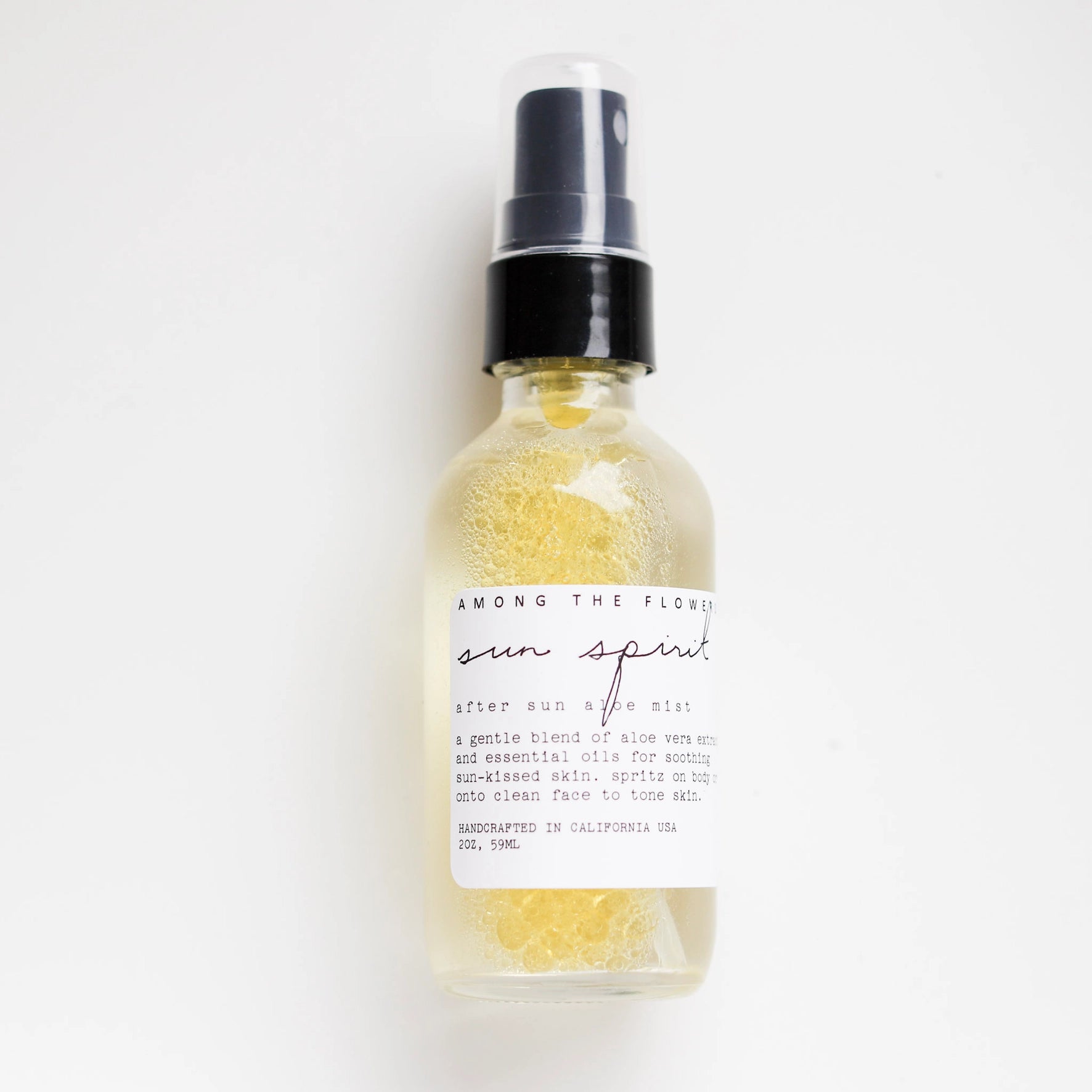 Among the Flowers Sun Spirit Cooling Aloe Mist in a clear spray bottle with a white label