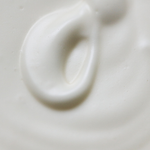 Close-up swirl of white Among the Flowers Tallow Body Cream showing its whipped texture
