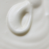 Close-up swirl of white Among the Flowers Tallow Body Cream showing its whipped texture