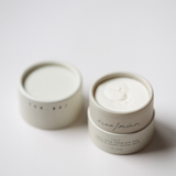 Among the Flowers Tallow Face Cream, two small white jars, one open showing the whipped cream