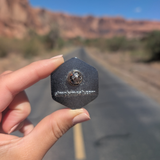 Back of the Arches National Park hexagon sunset enamel pin showing the rubber clutch.