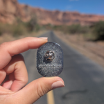 Back of the Arches National Park oval badge enamel pin showing the rubber clutch.