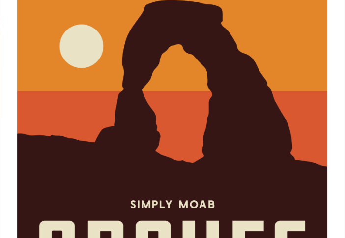 Arches National Park magnet with Delicate Arch in silhouette against banded sunrise gold and coral