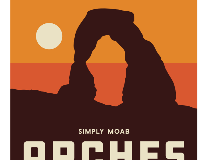 Arches National Park magnet with Delicate Arch in silhouette against banded sunrise gold and coral