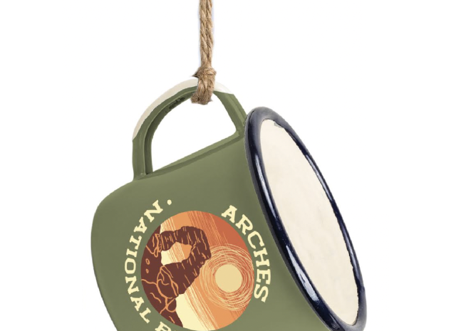 Miniature olive enamel camp mug ornament with an Arches National Park badge, hung on jute cord