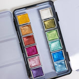 Bailey Rae Studio 12 Color Travel Metallic Watercolor Paint Palette, close-up of shimmering metallic pans in gold, green, pink, purple, blue and silver