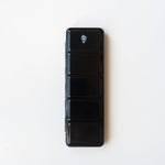 Bailey Rae Studio 24 Color Watercolor Paint Palette, closed black metal travel tin with a small logo, on white