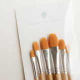 Close-up of the orange filbert brush heads on the Bailey Rae Studio Watercolor Brush Set of 6
