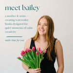 Meet Bailey, the mother and artist behind Bailey Rae Studio, holding a bouquet of pink tulips