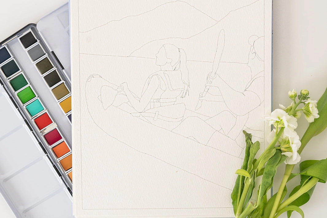Bailey Rae Studio Landscape Watercoloring Book open to a mountain outline with a paint palette and flowers