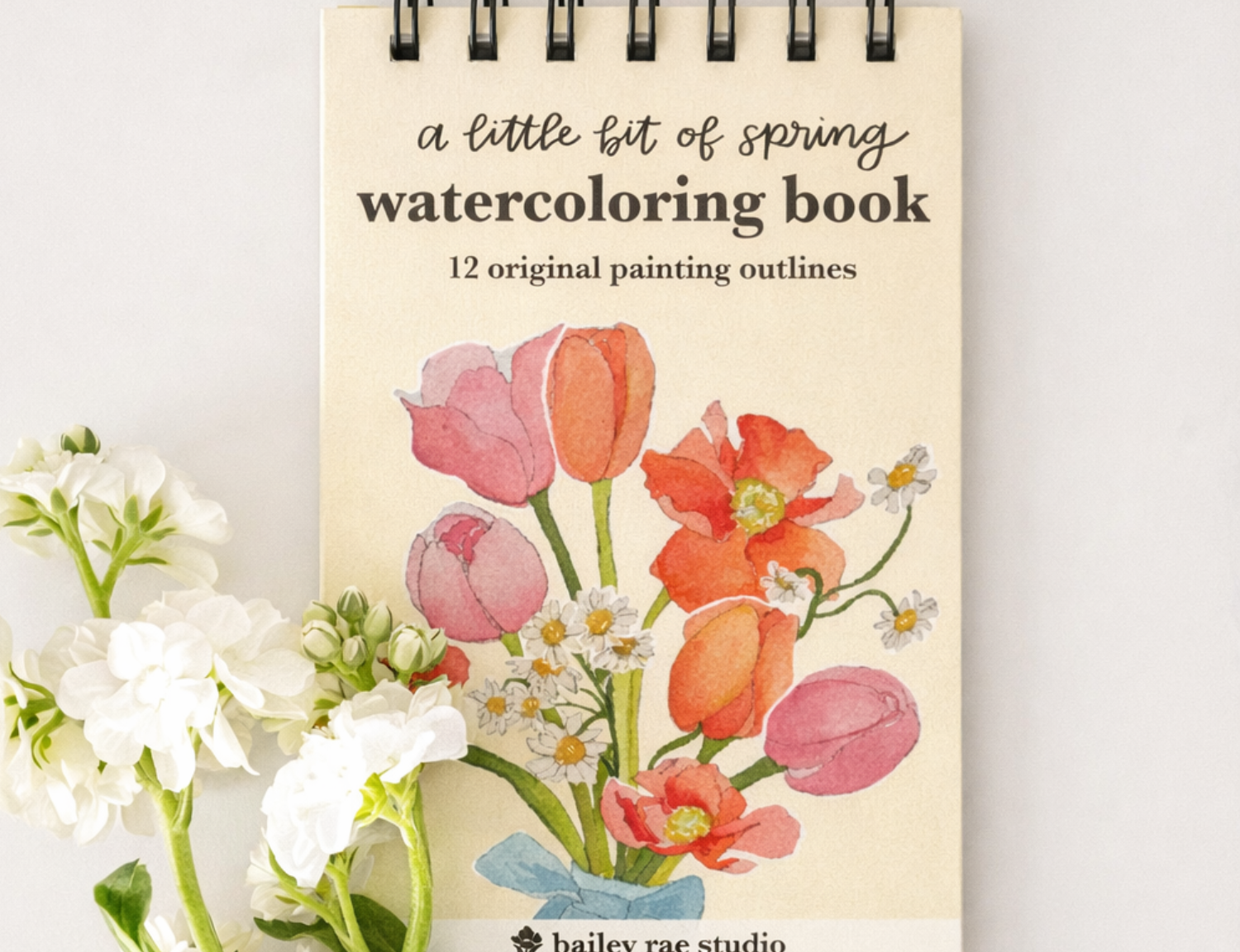 Bailey Rae Studio Mini A Little Bit of Spring Watercoloring Book, spiral-bound cover with pink and orange tulips beside white flowers