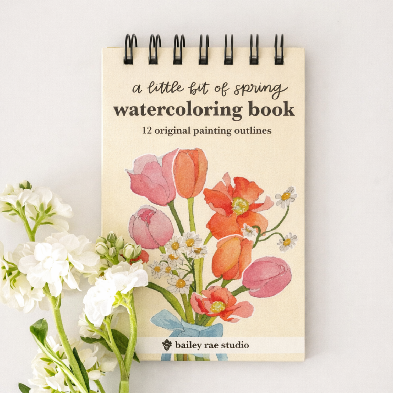 Bailey Rae Studio Mini A Little Bit of Spring Watercoloring Book, spiral-bound cover with pink and orange tulips beside white flowers