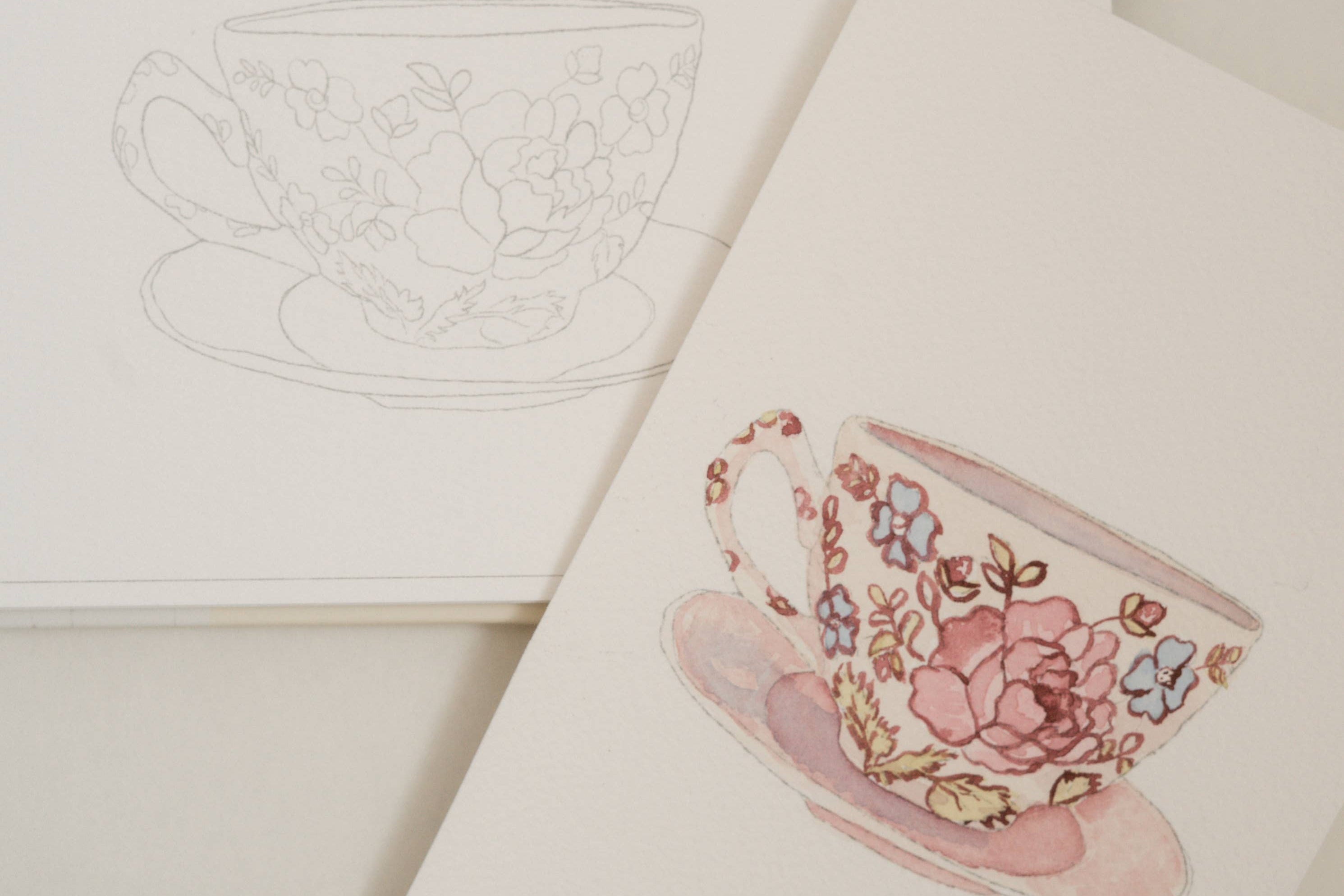 Bailey Rae Studio Mini A Little Bit of Spring Watercoloring Book, teacup outline page beside a painted pink floral teacup