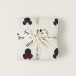 Barefoot Dreams Classic Disney Baby Blanket folded and tied with a Disney and Barefoot Dreams ribbon