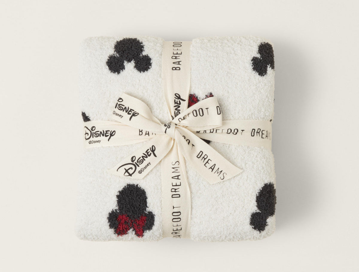 Barefoot Dreams Classic Disney Baby Blanket folded and tied with a Disney and Barefoot Dreams ribbon