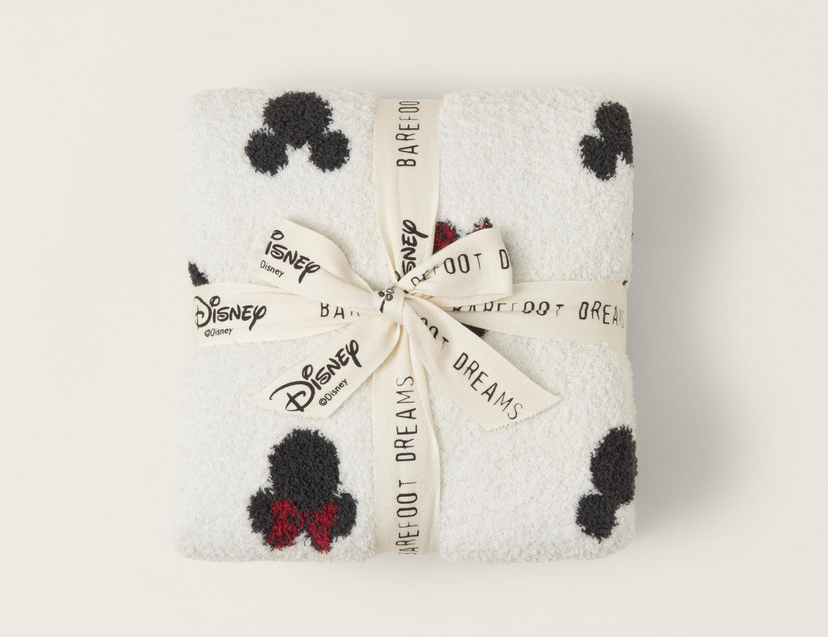 Barefoot Dreams Classic Disney Baby Blanket folded and tied with a Disney and Barefoot Dreams ribbon