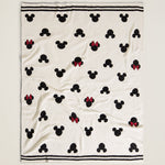 Barefoot Dreams Classic Disney Baby Blanket laid loosely with the Mickey and Minnie print