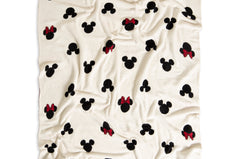 Barefoot Dreams Classic Disney Throw, a cream throw with black Mickey and red-bow Minnie icons