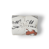 Barefoot Dreams Cozy Disney Princess Blanket in Ariel folded and tied with a Disney ribbon