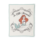 Barefoot Dreams Cozy Disney Princess Blanket in Ariel, a cream knit blanket with The Little Mermaid design and teal border