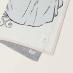 Close-up of the Cinderella gown knit detail and pink edge on the Barefoot Dreams Cozy Disney Princess Blanket
