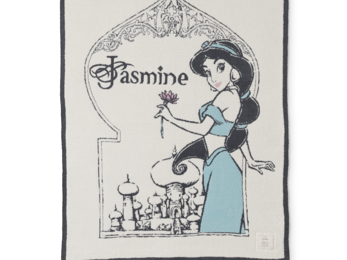Barefoot Dreams Cozy Disney Princess Blanket in Jasmine, a cream knit blanket with a Jasmine design and navy border
