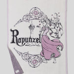Close-up of the Rapunzel lettering and purple gown knit on the Barefoot Dreams Cozy Disney Princess Blanket