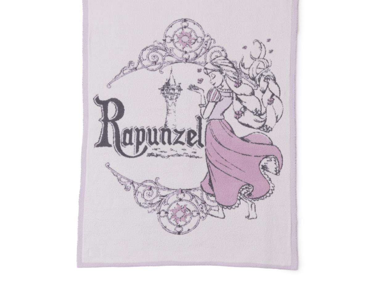 Barefoot Dreams Cozy Disney Princess Blanket in Rapunzel, a lavender knit blanket with a Rapunzel design
