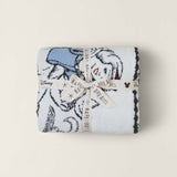Barefoot Dreams Cozy Disney Princess Blanket in Snow White folded and tied with a Disney ribbon