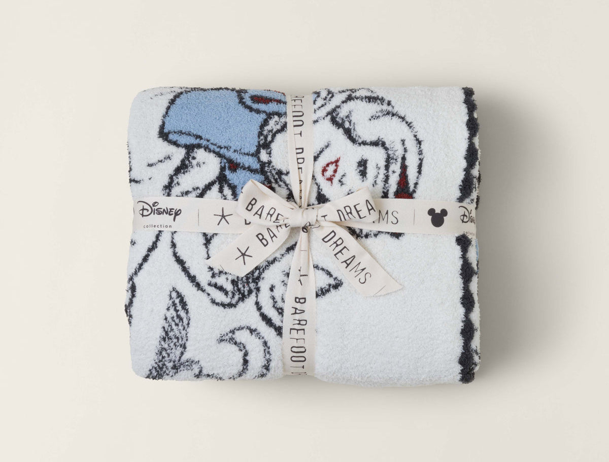 Barefoot Dreams Cozy Disney Princess Blanket in Snow White folded and tied with a Disney ribbon