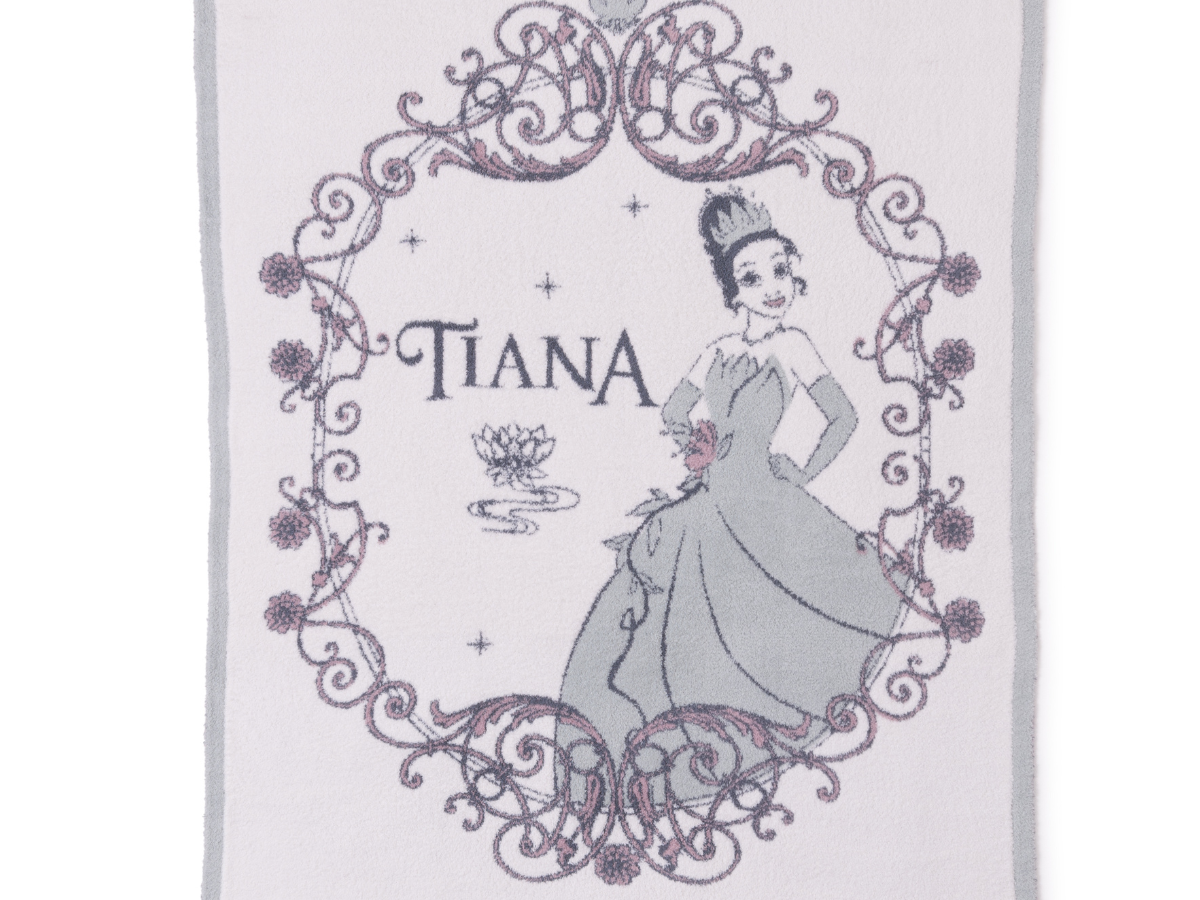 Barefoot Dreams Cozy Disney Princess Blanket in Tiana, a pale lavender knit blanket with a Tiana design