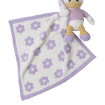 Barefoot Dreams Disney Blanket Buddie in Daisy Duck, plush Daisy on a purple daisy-print lovey blanket