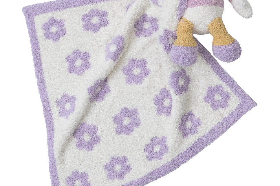 Barefoot Dreams Disney Blanket Buddie in Daisy Duck, plush Daisy on a purple daisy-print lovey blanket